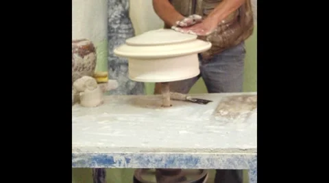Hands of potter do a clay dish Stock Footage 8650847