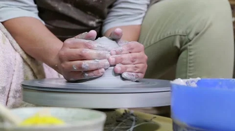 Hands of potter do a clay pot Video stock 61924420