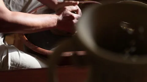 Hands of potter making a clay jug Stock Footage 61880560