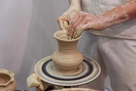 Hands of a potter making jug. Professions Stock Photos