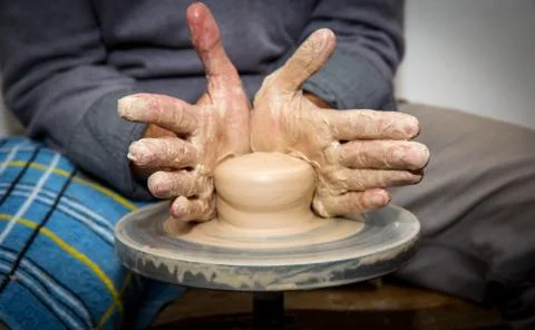 Hands of potter man Stock Photos