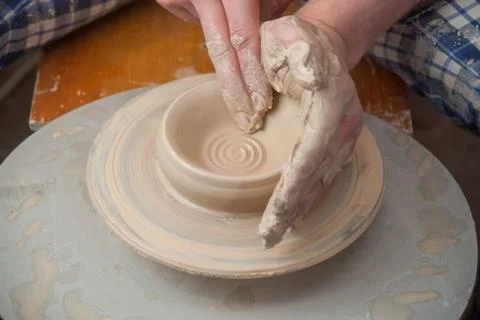 Hands of a potter Stock Photos
