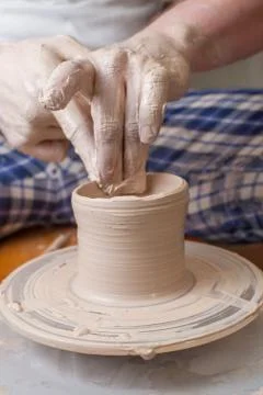 Hands of a potter Stock Photos