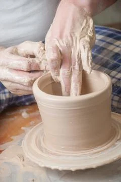 Hands of a potter Stock Photos