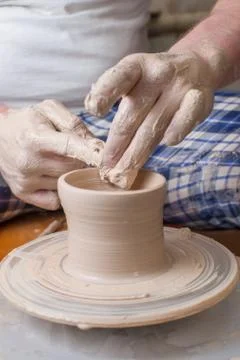 Hands of a potter Stock Photos