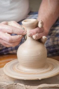 Hands of a potter Stock Photos