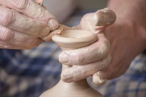 Hands of a potter Stock Photos