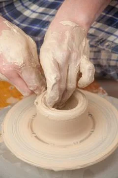 Hands of a potter Stock Photos