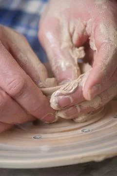 Hands of a potter Stock Photos
