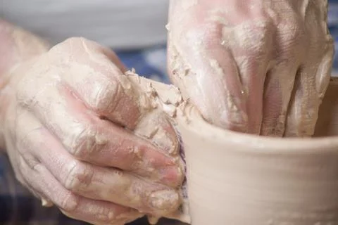 Hands of a potter Stock Photos