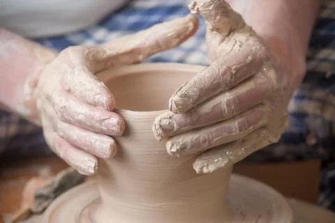 Hands of a potter Stock Photos