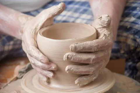 Hands of a potter Stock Photos