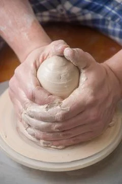 Hands of a potter Stock Photos