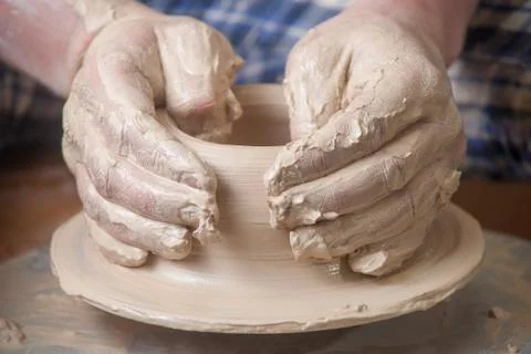 Hands of a potter Stock Photos
