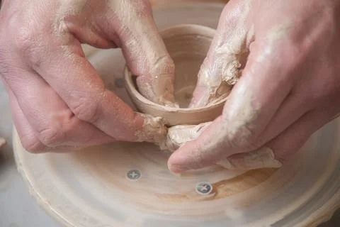 Hands of a potter Stock Photos