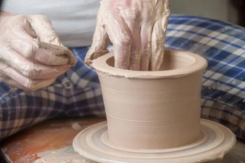 Hands of a potter Stock Photos