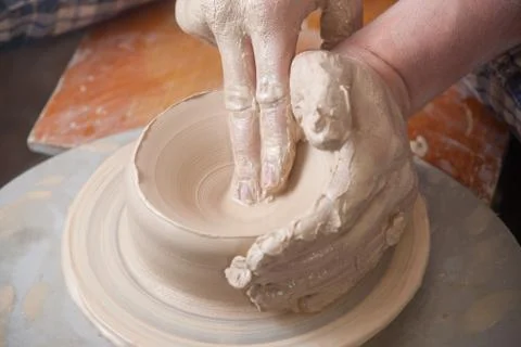 Hands of a potter Stock Photos