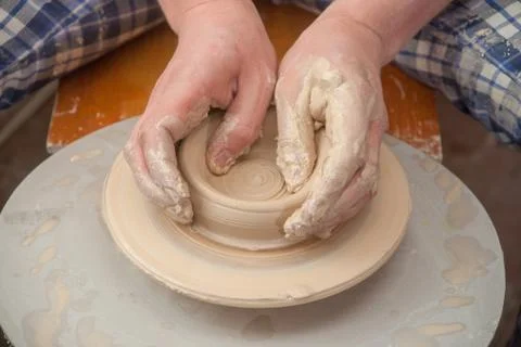 Hands of a potter Stock Photos