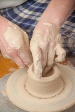 Hands of a potter Stock Photos