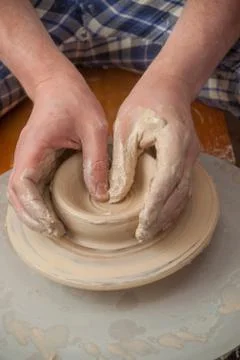 Hands of a potter Stock Photos