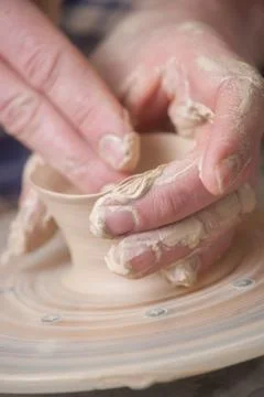 Hands of a potter Stock Photos