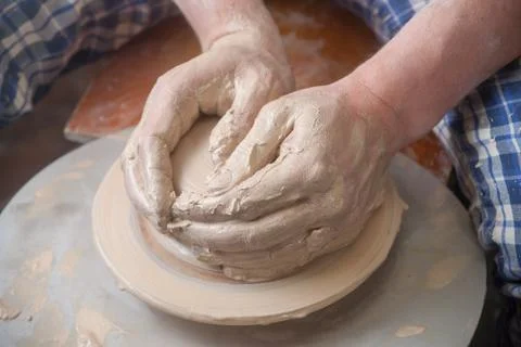 Hands of a potter Stock Photos