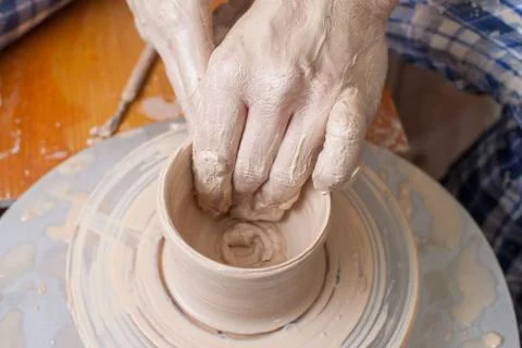 Hands of a potter Stock Photos
