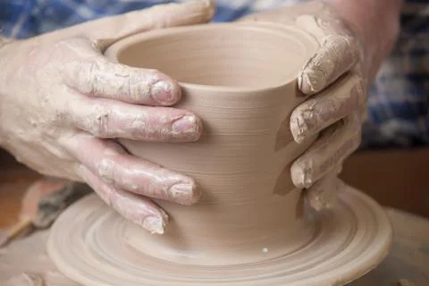 Hands of a potter Stock Photos