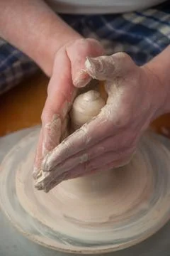 Hands of a potter Stock Photos