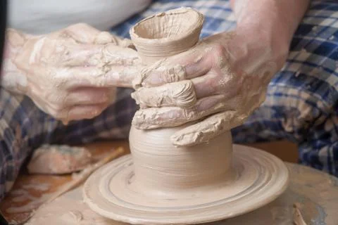 Hands of a potter Stock Photos