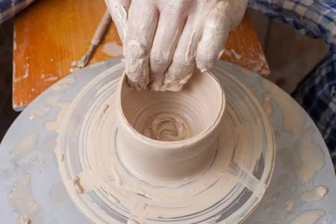 Hands of a potter Stock Photos
