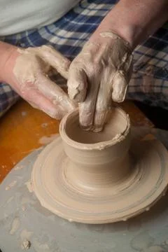 Hands of a potter Stock Photos