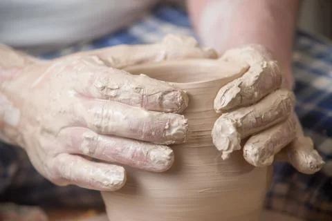 Hands of a potter Stock Photos