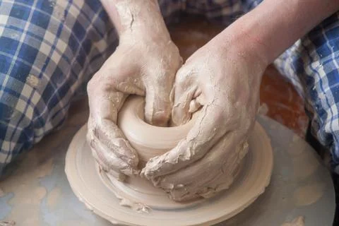 Hands of a potter Stock Photos