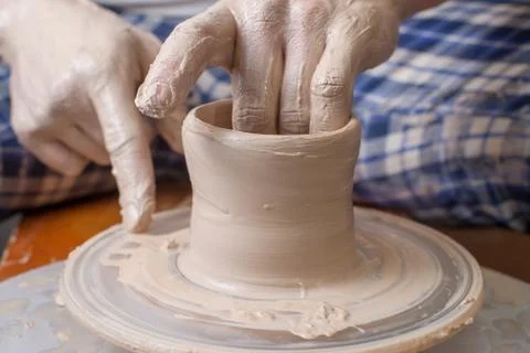 Hands of a potter Stock Photos