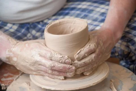 Hands of a potter Stock Photos