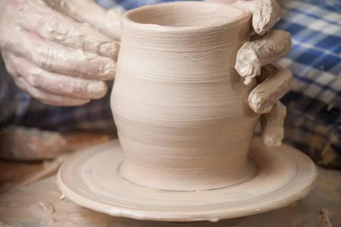 Hands of a potter Stock Photos