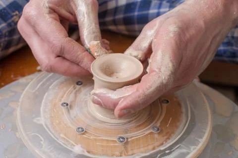 Hands of a potter Stock Photos