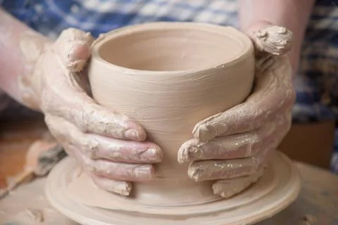 Hands of a potter Stock Photos