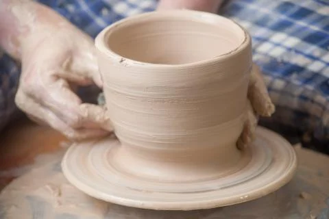 Hands of a potter Stock Photos