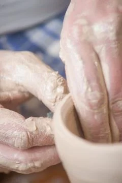 Hands of a potter Stock Photos