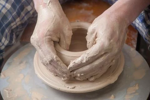 Hands of a potter Stock Photos