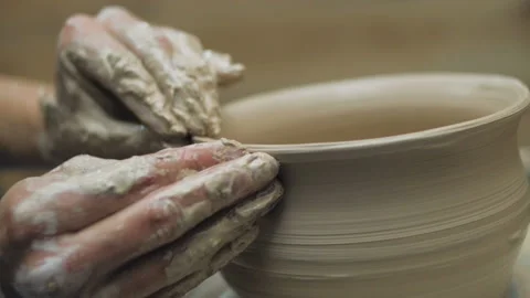 Hands Of Potter. Potter Making Ceramic Pot On A Potter's Wheel. Potter At Work Stock Footage 117504751