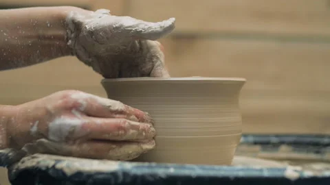 Hands Of Potter. Potter Making Ceramic Pot On A Potter's Wheel. Potter At Work Stock Footage 117504923