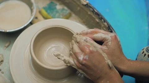 Hands Of Potter. Potter Making Ceramic Pot On A Potter's Wheel. Potter At Work Stock Footage 117505276