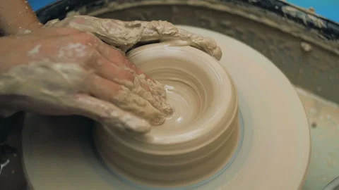 Hands Of Potter. Potter Making Ceramic Pot On A Potter's Wheel. Potter At Work Stock Footage 117505452