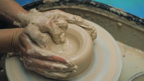 Hands Of Potter. Potter Making Ceramic Pot On A Potter's Wheel. Potter At Work Stock Footage 117505796