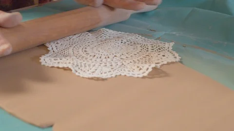 The hands of the potter put drawing on clay Video stock 112570596