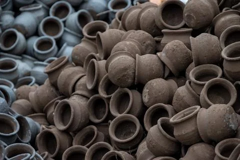 Hands of a potter at work. Potter making ceramic mug on the pottery wheel Stock Photos