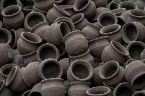 Hands of a potter at work. Potter making ceramic mug on the pottery wheel Stock Photos